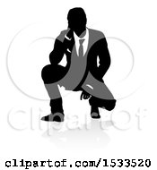 Poster, Art Print Of Silhouetted Business Man Crouching With A Reflection Or Shadow