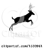 Clipart Of A Black Silhouetted Deer Stag Buck Leaping With A Shadow On A White Background Royalty Free Vector Illustration