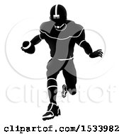 Clipart Of A Silhouetted American Football Player Charging Royalty Free Vector Illustration