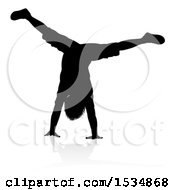 Silhouetted Boy Doing A Hand Stand With A Reflection Or Shadow On A White Background