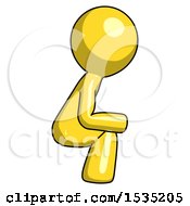 Yellow Design Mascot Man Squatting Facing Right