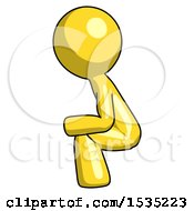 Yellow Design Mascot Man Squatting Facing Left
