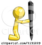 Yellow Design Mascot Man Posing With Giant Pen In Powerful Yet Awkward Manner