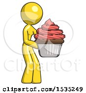 Yellow Design Mascot Woman Holding Large Cupcake Ready To Eat Or Serve