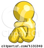 Yellow Design Mascot Man Sitting With Head Down Back View Facing Left