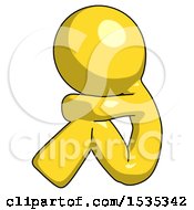 Yellow Design Mascot Man Sitting With Head Down Facing Sideways Left
