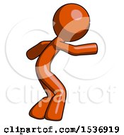 Orange Design Mascot Man Sneaking While Reaching For Something