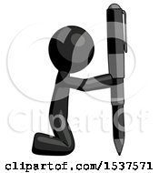 Black Design Mascot Man Posing With Giant Pen In Powerful Yet Awkward Manner