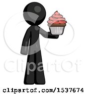 Black Design Mascot Man Presenting Pink Cupcake To Viewer