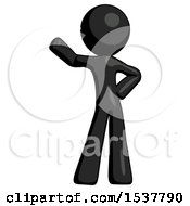 Black Design Mascot Man Waving Right Arm With Hand On Hip