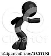 Black Design Mascot Man Sneaking While Reaching For Something