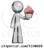 Gray Design Mascot Man Presenting Pink Cupcake To Viewer