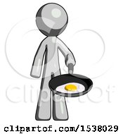 Gray Design Mascot Man Frying Egg In Pan Or Wok