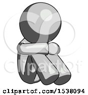 Gray Design Mascot Man Sitting With Head Down Facing Angle Right