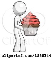 White Design Mascot Woman Holding Large Cupcake Ready To Eat Or Serve