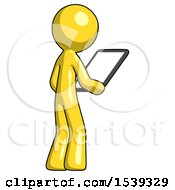 Poster, Art Print Of Yellow Design Mascot Man Looking At Tablet Device Computer Facing Away