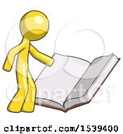 Yellow Design Mascot Man Reading Big Book While Standing Beside It
