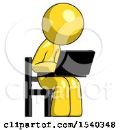 Yellow Design Mascot Man Using Laptop Computer While Sitting In Chair Angled Right