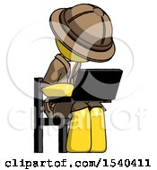Yellow Explorer Ranger Man Using Laptop Computer While Sitting In Chair Angled Right