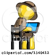 Yellow Explorer Ranger Man Using Laptop Computer While Sitting In Chair View From Back