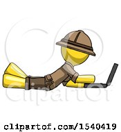 Poster, Art Print Of Yellow Explorer Ranger Man Using Laptop Computer While Lying On Floor Side View