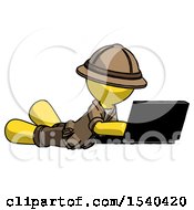Poster, Art Print Of Yellow Explorer Ranger Man Using Laptop Computer While Lying On Floor Side Angled View