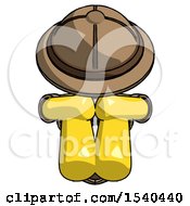 Yellow Explorer Ranger Man Sitting With Head Down Facing Forward