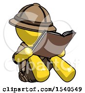 Yellow Explorer Ranger Man Reading Book While Sitting Down