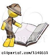 Yellow Explorer Ranger Man Reading Big Book While Standing Beside It