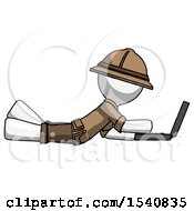 Poster, Art Print Of White Explorer Ranger Man Using Laptop Computer While Lying On Floor Side View