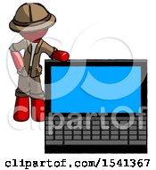 Red Explorer Ranger Man Beside Large Laptop Computer Leaning Against It