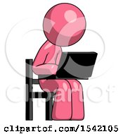 Pink Design Mascot Man Using Laptop Computer While Sitting In Chair Angled Right