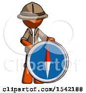Poster, Art Print Of Orange Explorer Ranger Man Standing Beside Large Compass