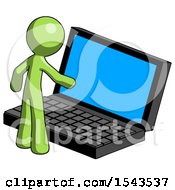 Green Design Mascot Man Using Large Laptop Computer