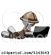Gray Explorer Ranger Man Using Laptop Computer While Lying On Floor Side Angled View