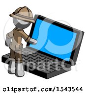Gray Explorer Ranger Man Using Large Laptop Computer