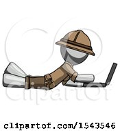 Gray Explorer Ranger Man Using Laptop Computer While Lying On Floor Side View