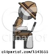 Poster, Art Print Of Gray Explorer Ranger Man Using Laptop Computer While Sitting In Chair View From Side