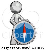 Gray Design Mascot Man Standing Beside Large Compass