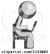 Gray Design Mascot Man Using Laptop Computer While Sitting In Chair View From Side