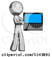 Gray Design Mascot Man Holding Laptop Computer Presenting Something On Screen
