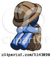 Blue Explorer Ranger Man Sitting With Head Down Facing Angle Left
