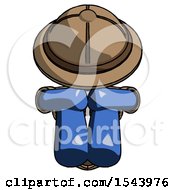 Blue Explorer Ranger Man Sitting With Head Down Facing Forward