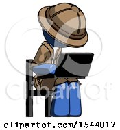 Blue Explorer Ranger Man Using Laptop Computer While Sitting In Chair Angled Right