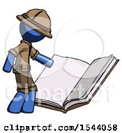 Blue Explorer Ranger Man Reading Big Book While Standing Beside It