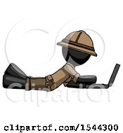 Poster, Art Print Of Black Explorer Ranger Man Using Laptop Computer While Lying On Floor Side View