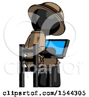 Black Explorer Ranger Man Using Laptop Computer While Sitting In Chair View From Back