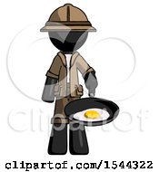 Black Explorer Ranger Man Frying Egg In Pan Or Wok