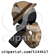 Black Explorer Ranger Man Sitting With Head Down Facing Sideways Left