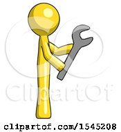 Yellow Design Mascot Man Using Wrench Adjusting Something To Right